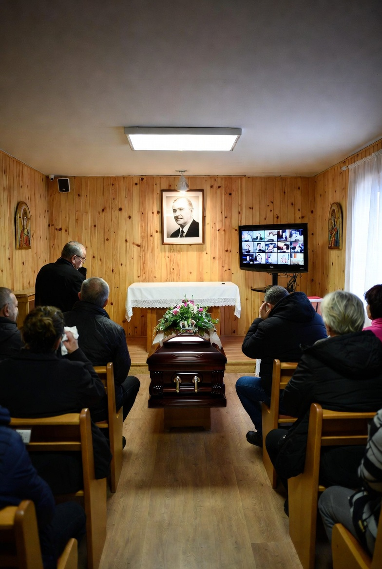 Family and friends gathered for a memorial service in a small chapel